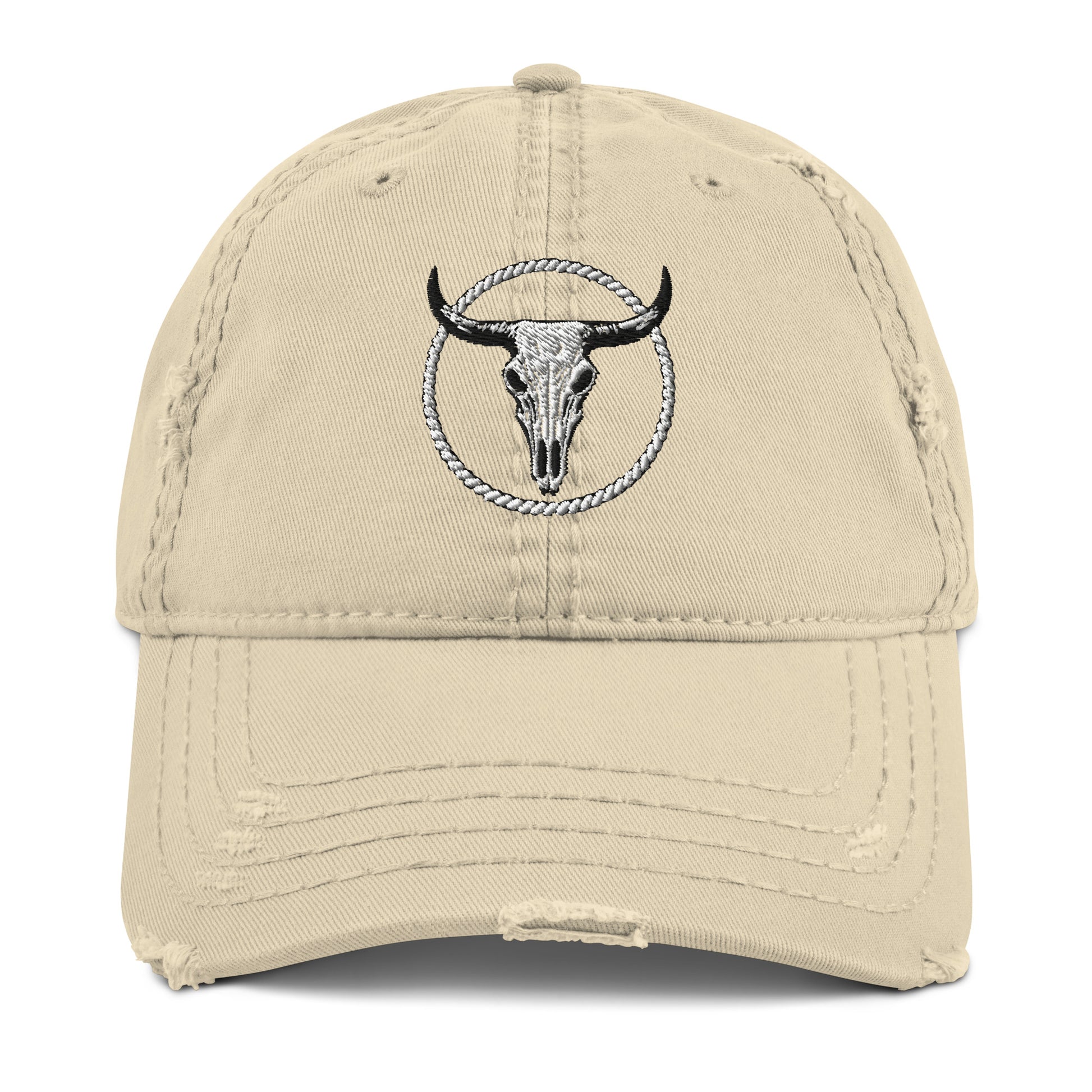 mntain beige distressed dad hat with embroidered bull skull and rope design on front