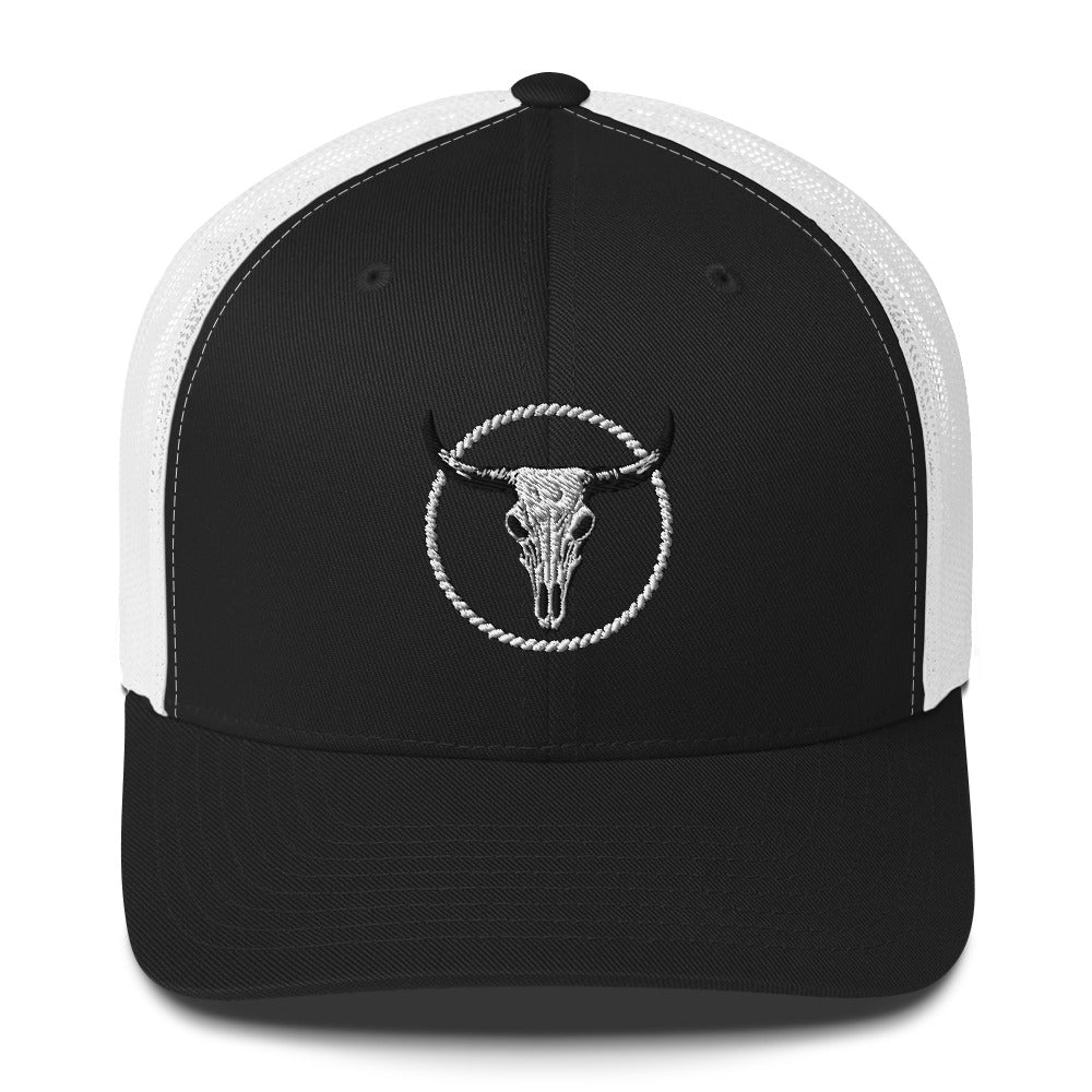 Black and white MNTAIN Trucker hat with embroidered bull skull design on front