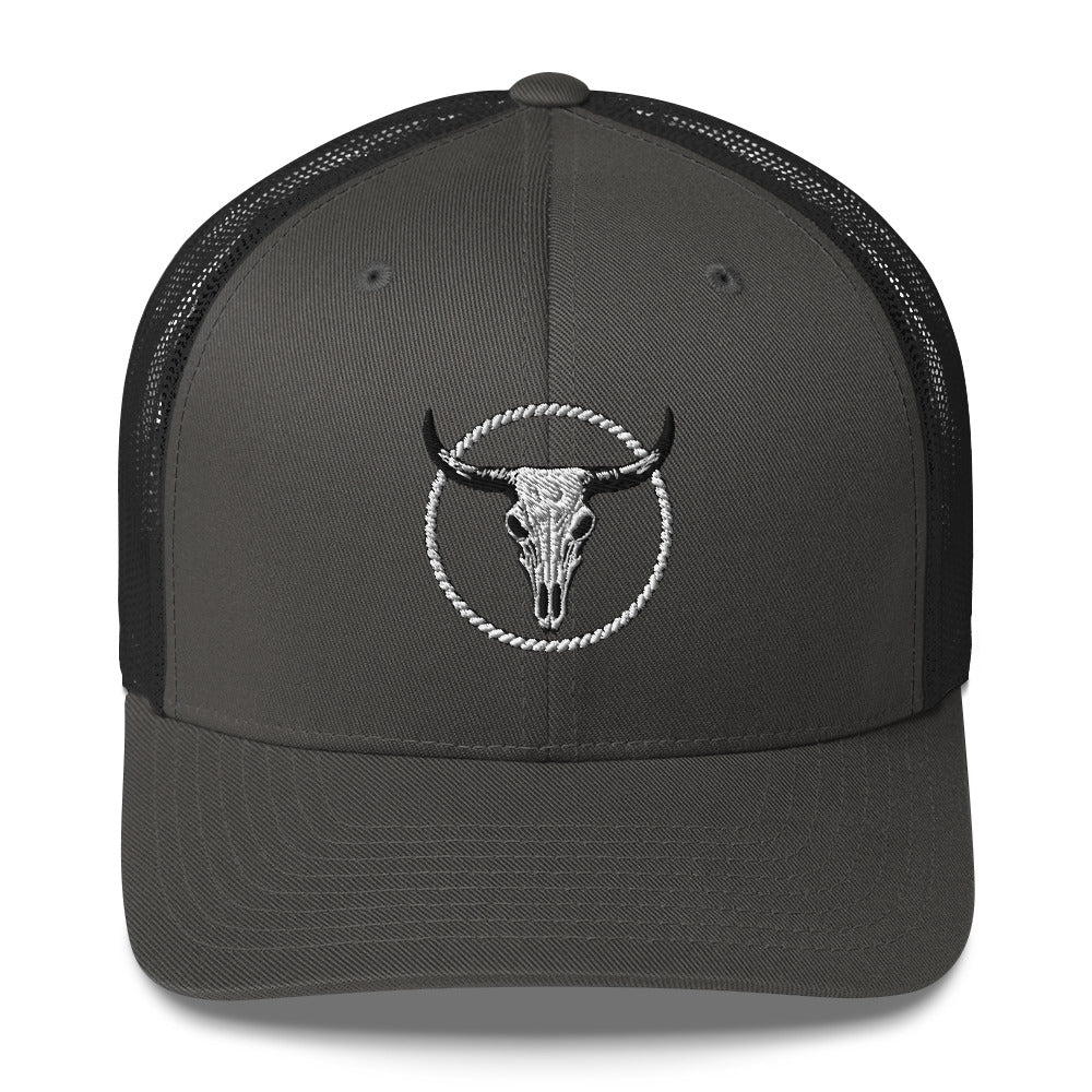 Black MNTAIN Trucker hat with embroidered bull skull design and mesh back panels