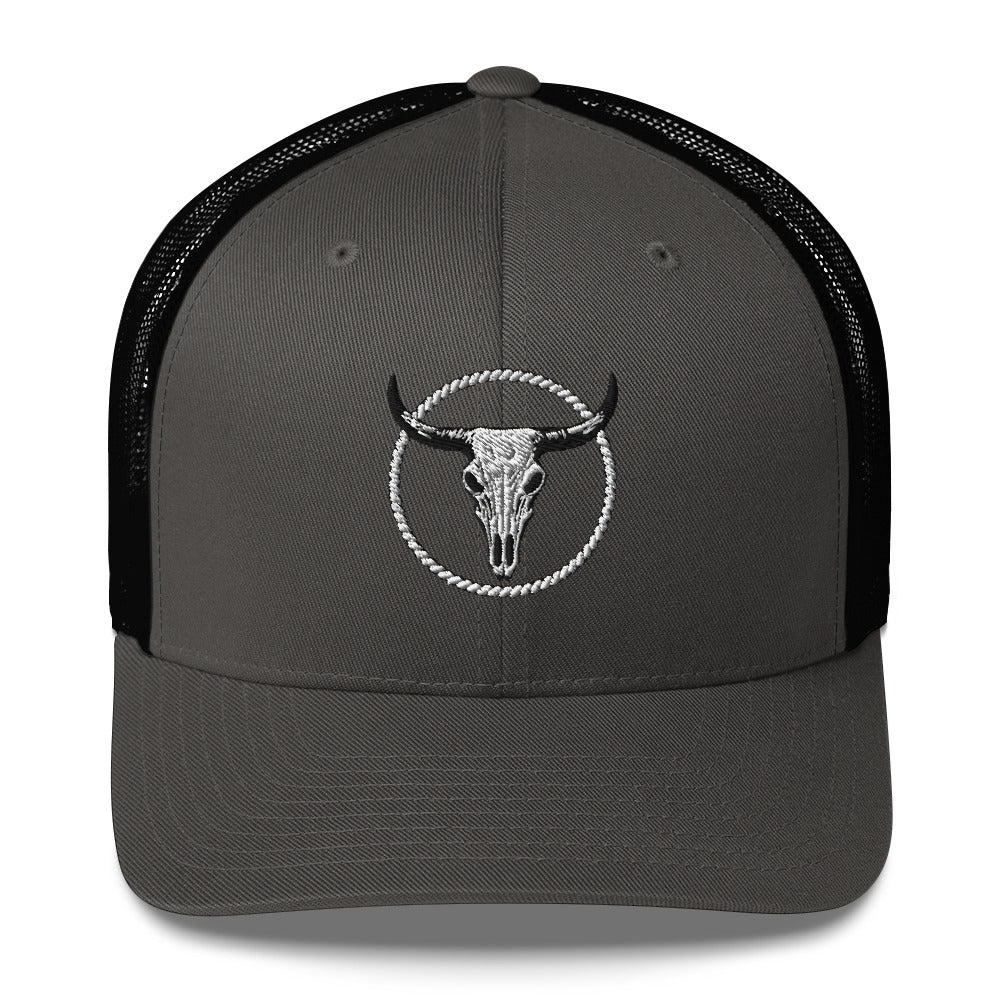 Dark gray MNTAIN Trucker hat with black mesh back and embroidered bull skull design
