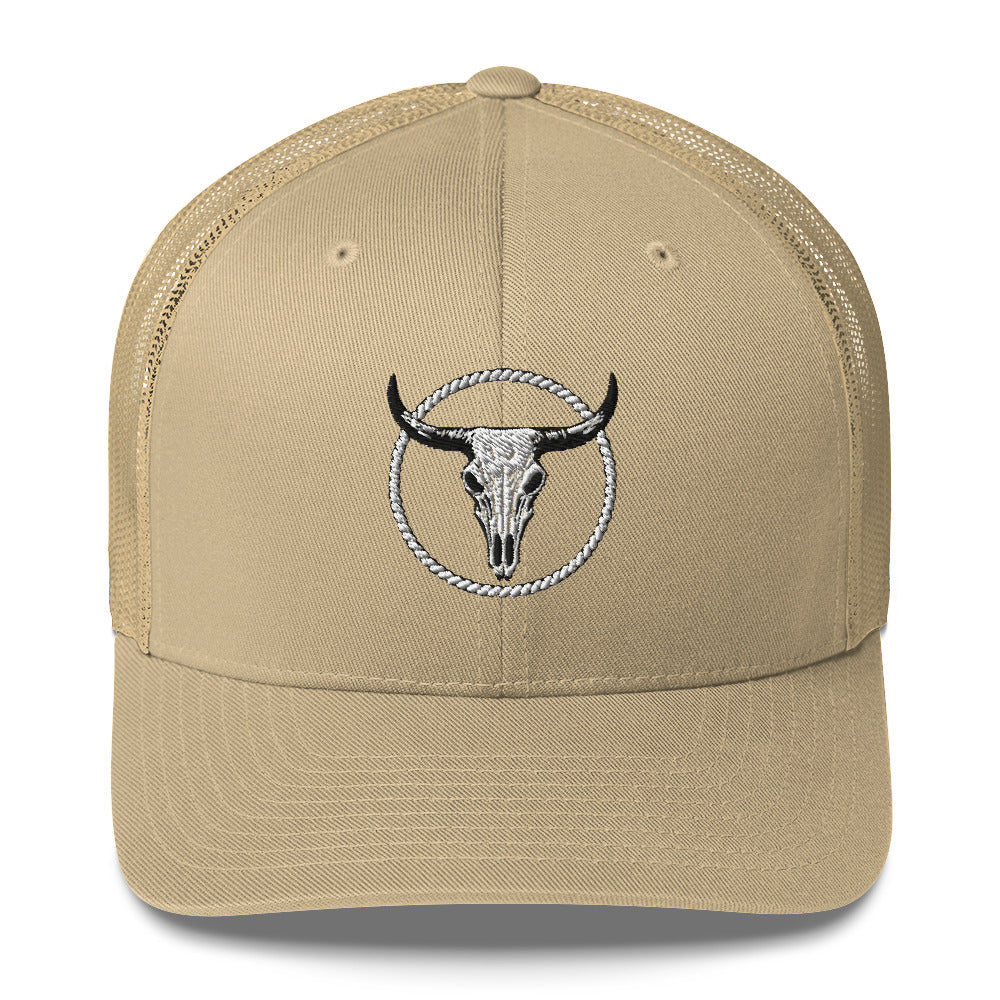 Beige MNTAIN Trucker hat with black and white bull skull embroidery and mesh back panels