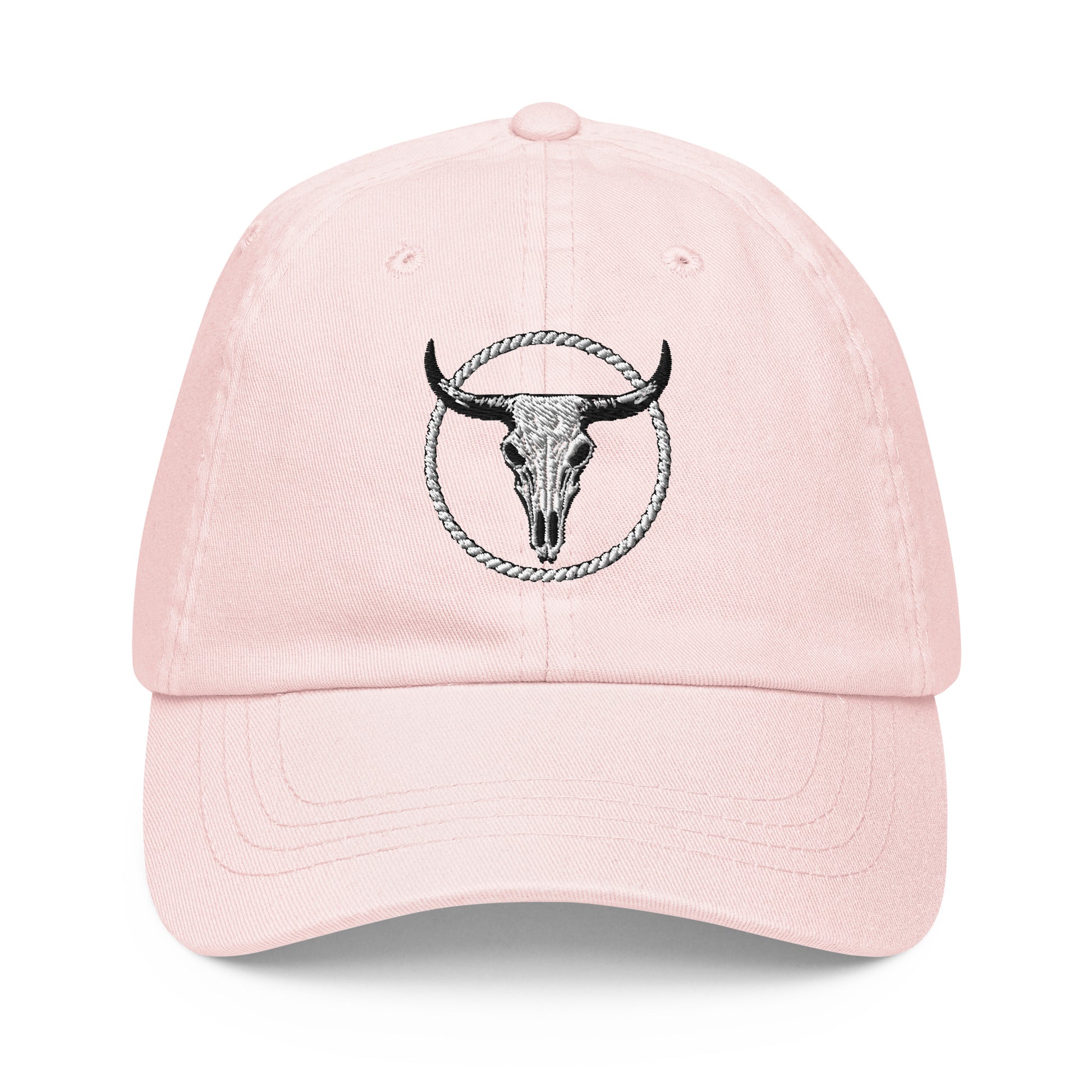 mntain outlaw pastel baseball cap in light pink with black bull skull embroidery on front