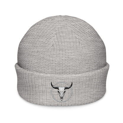 mntain rugged fisherman beanie in light gray with a black bull skull emblem on the cuff